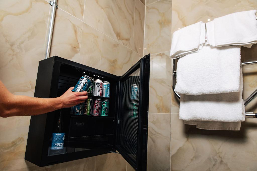 Beer fridge in the shower at Brewdog Kennels, Aberdeen