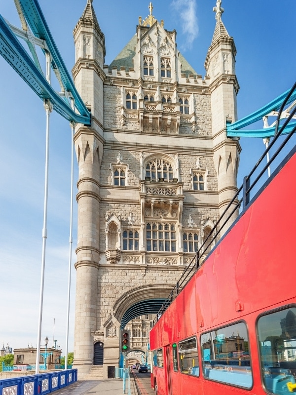 A double decker bus crossing Tower Bridge