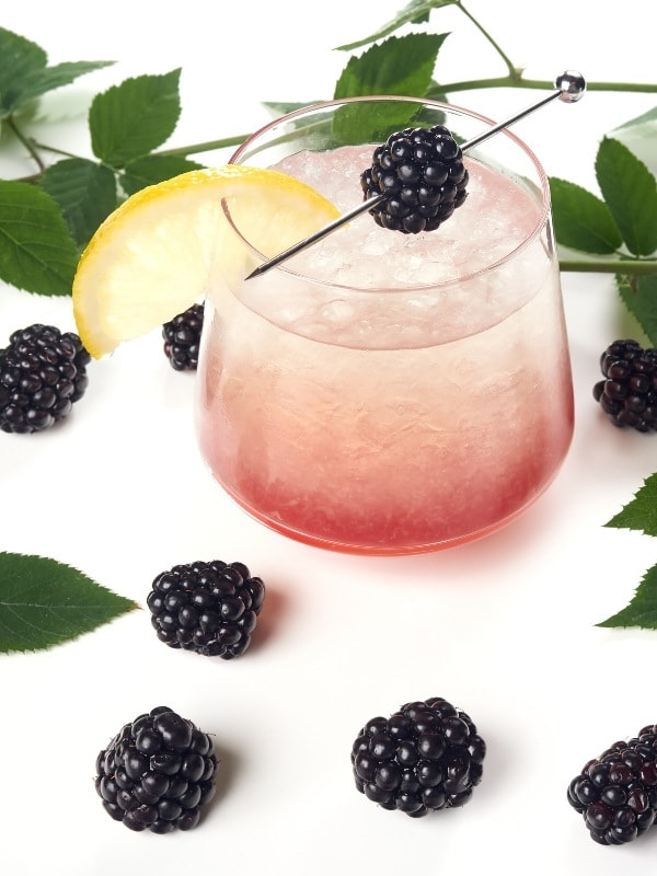 Lemon, blackberries and gin for a Bramble cocktail