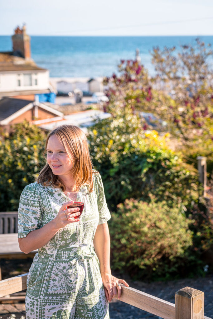 enjoying a glass of wine on the terrace with sea views